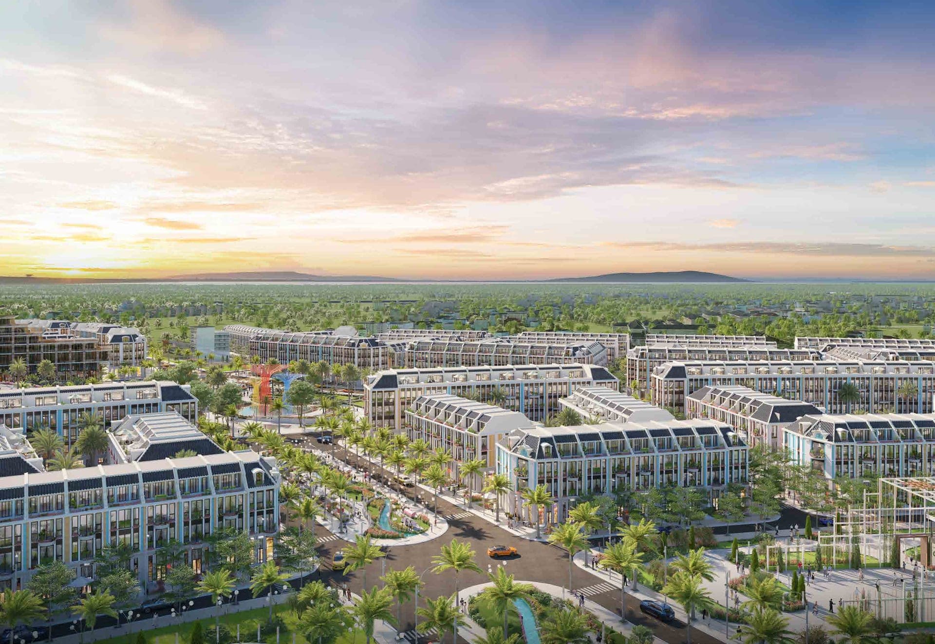 Phối cảnh Grandeur Avenue nhìn từ trên cao lúc hoàng hôn: các dãy nhà phố mái xanh quanh trục xanh trung tâm